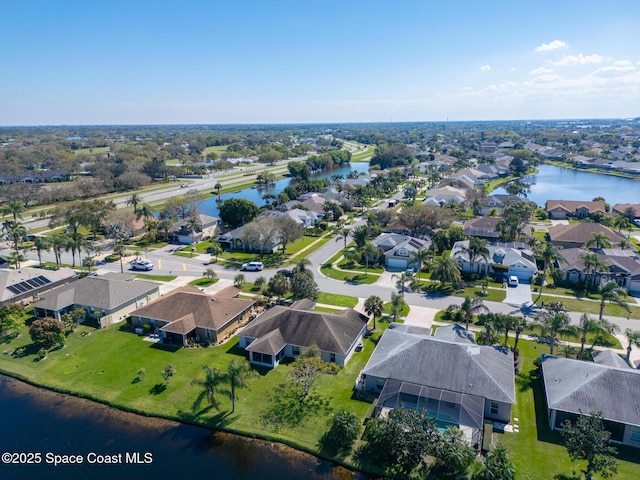 aerial view featuring a water view and a residential view