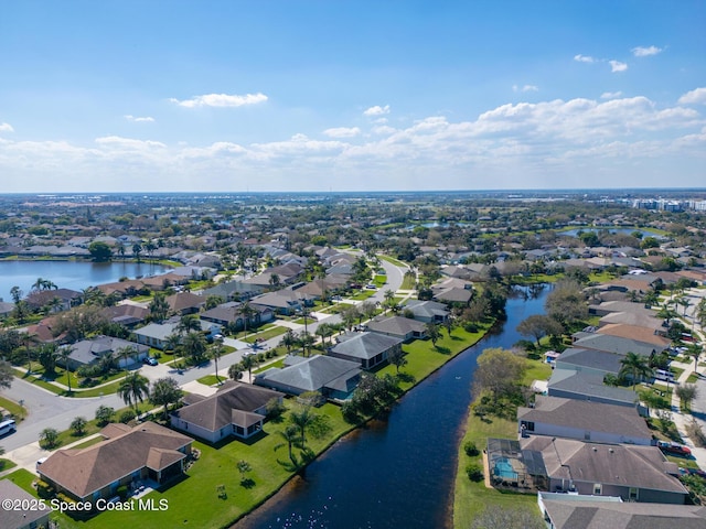 bird's eye view with a water view and a residential view