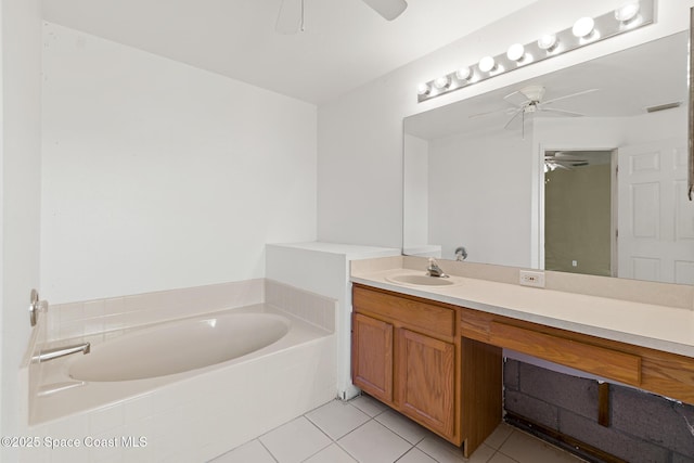 bathroom with a garden tub, visible vents, a ceiling fan, vanity, and tile patterned floors