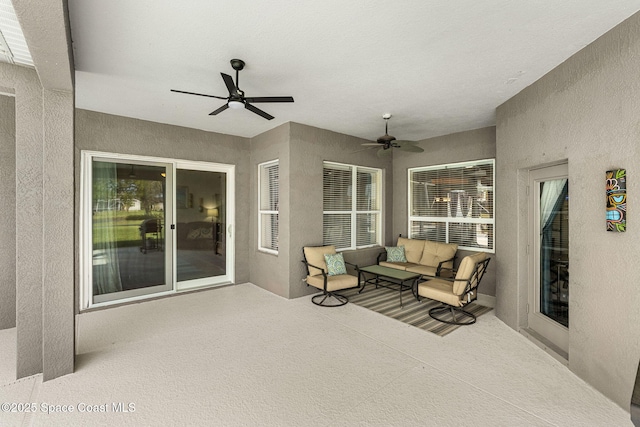 view of patio with a ceiling fan and outdoor lounge area