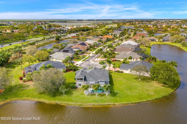 birds eye view of property featuring a residential view and a water view