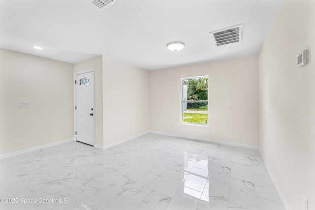 2100 Cogan Dr SE, Palm Bay, FL 32909 - spare room featuring visible vents, baseboards, and marble finish floor