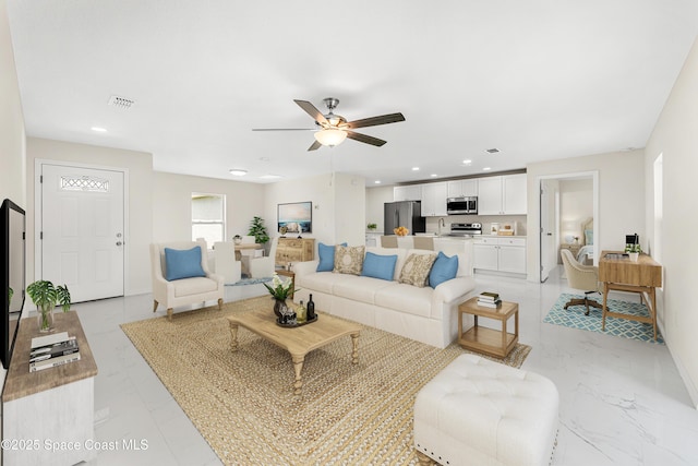 2100 Cogan Dr SE, Palm Bay, FL 32909 - living area with visible vents, marble finish floor, recessed lighting, baseboards, and ceiling fan