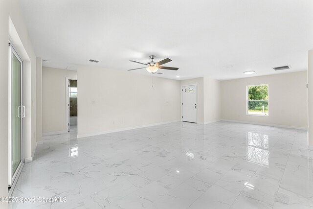 2100 Cogan Dr SE, Palm Bay, FL 32909 - empty room featuring a ceiling fan, visible vents, marble finish floor, and baseboards