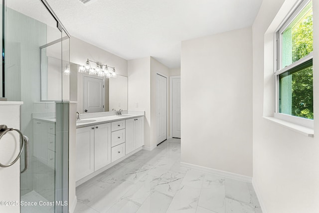2100 Cogan Dr SE, Palm Bay, FL 32909 - full bath with a sink, baseboards, marble finish floor, and double vanity