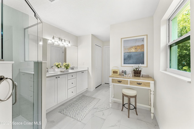 2100 Cogan Dr SE, Palm Bay, FL 32909 - bathroom featuring a shower stall, baseboards, double vanity, marble finish floor, and a sink