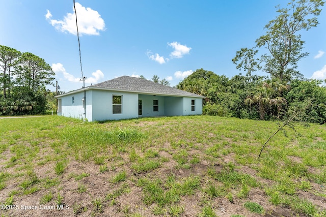 2100 Cogan Dr SE, Palm Bay, FL 32909 - rear view of house with stucco siding