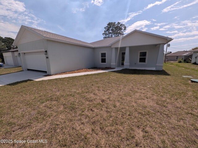 2100 Cogan Dr SE, Palm Bay, FL 32909 - single story home with driveway, a front lawn, and an attached garage