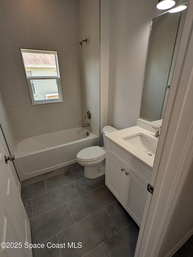 2100 Cogan Dr SE, Palm Bay, FL 32909 - full bath featuring tile patterned floors, toilet, vanity, and bathtub / shower combination