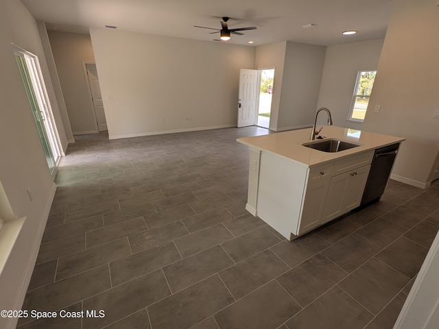 2100 Cogan Dr SE, Palm Bay, FL 32909 - kitchen with open floor plan, light countertops, dishwashing machine, a ceiling fan, and a sink