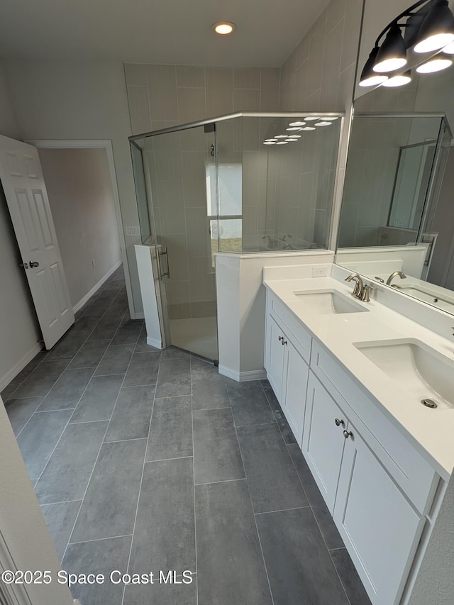 2100 Cogan Dr SE, Palm Bay, FL 32909 - full bath with double vanity, a stall shower, and a sink