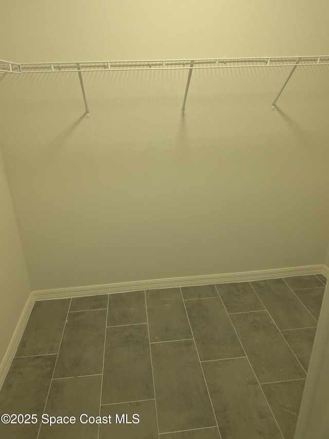 2100 Cogan Dr SE, Palm Bay, FL 32909 - spacious closet with dark tile patterned flooring