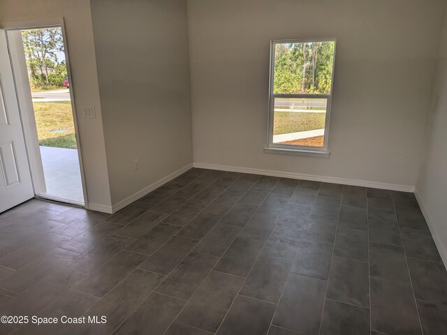 2100 Cogan Dr SE, Palm Bay, FL 32909 - unfurnished room with a wealth of natural light and baseboards