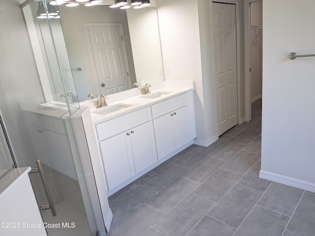 2100 Cogan Dr SE, Palm Bay, FL 32909 - full bathroom with a sink, a stall shower, double vanity, and tile patterned flooring