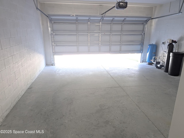 2100 Cogan Dr SE, Palm Bay, FL 32909 - garage with a garage door opener and concrete block wall