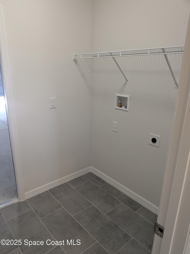2100 Cogan Dr SE, Palm Bay, FL 32909 - clothes washing area featuring electric dryer hookup, baseboards, washer hookup, and laundry area