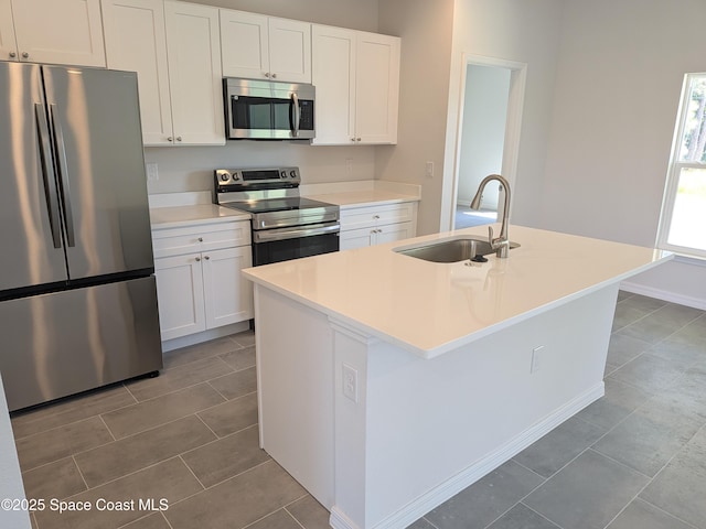 2100 Cogan Dr SE, Palm Bay, FL 32909 - kitchen featuring white cabinets, appliances with stainless steel finishes, and a sink