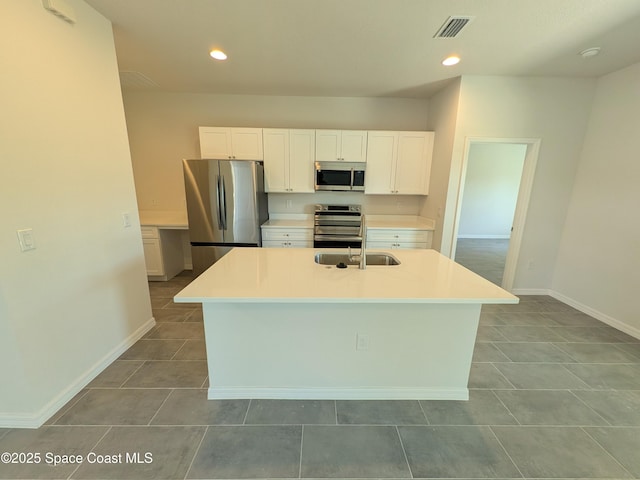 2100 Cogan Dr SE, Palm Bay, FL 32909 - kitchen with white cabinetry, recessed lighting, visible vents, and appliances with stainless steel finishes