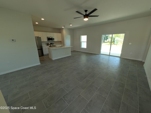 2100 Cogan Dr SE, Palm Bay, FL 32909 - unfurnished living room with recessed lighting, baseboards, and a ceiling fan
