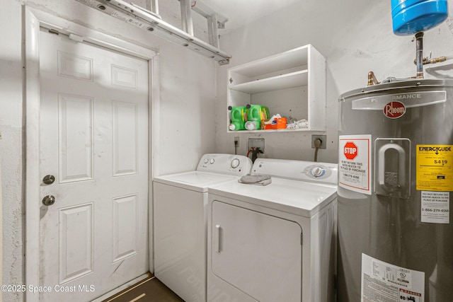 washroom with laundry area, washer and clothes dryer, and electric water heater