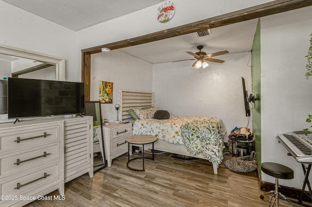 bedroom featuring light wood-style flooring and visible vents