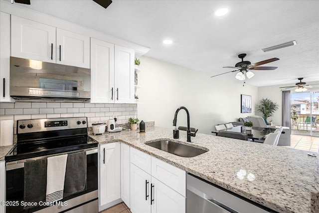 kitchen with stainless steel appliances, visible vents, backsplash, white cabinetry, and a sink