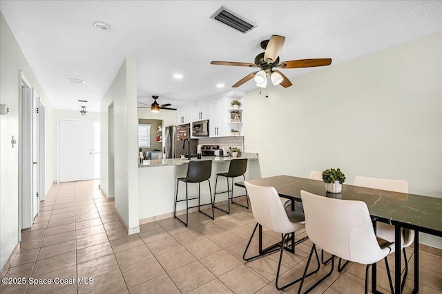 dining room featuring recessed lighting, visible vents, ceiling fan, and light tile patterned flooring