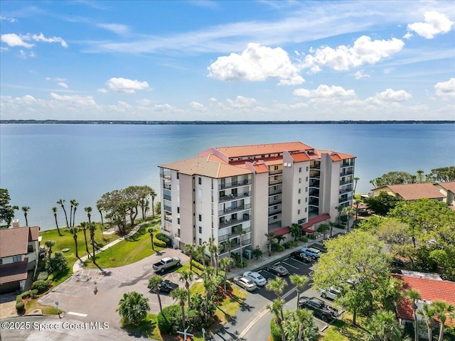 birds eye view of property with a water view