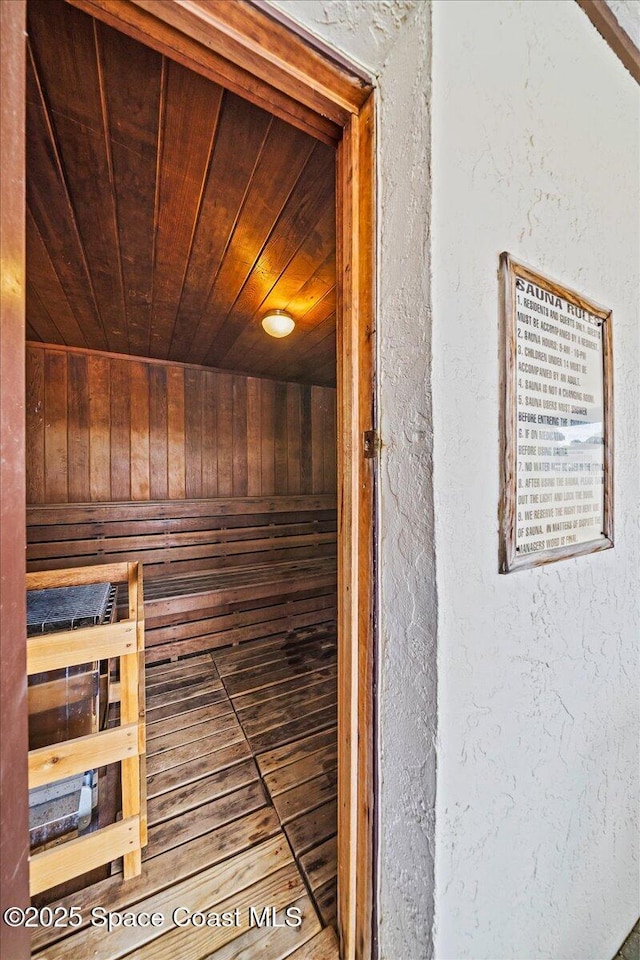 view of sauna featuring a textured wall