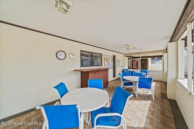 sunroom / solarium featuring ceiling fan and visible vents