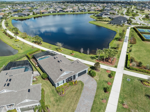 bird's eye view with a residential view and a water view