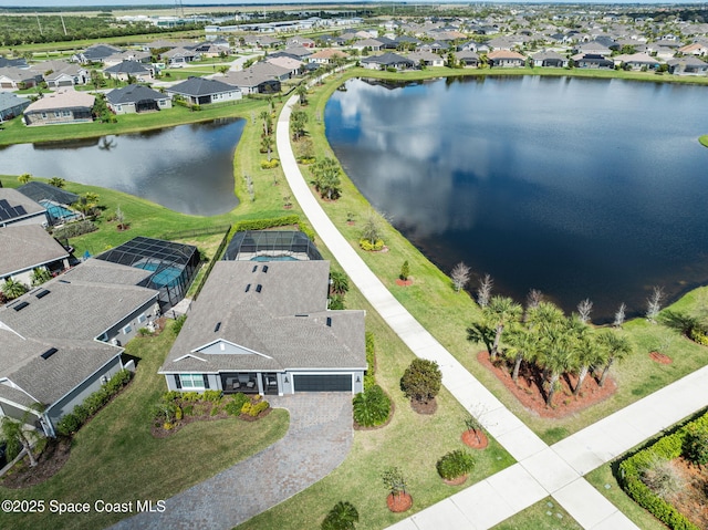 aerial view featuring a water view and a residential view