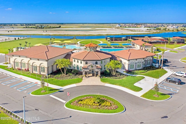 birds eye view of property with a water view