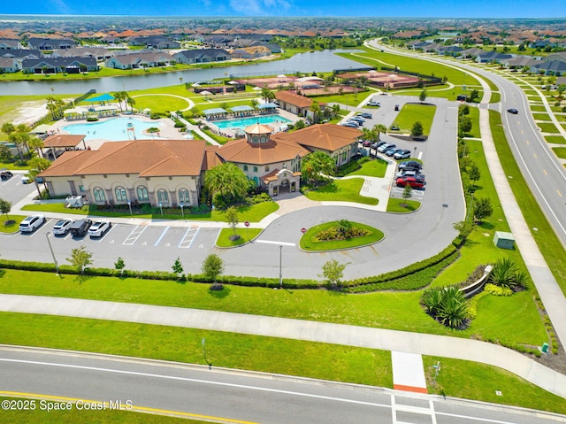 bird's eye view featuring a residential view and a water view