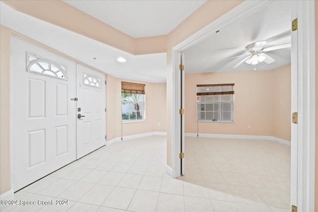 entrance foyer with a ceiling fan, recessed lighting, baseboards, and light tile patterned floors