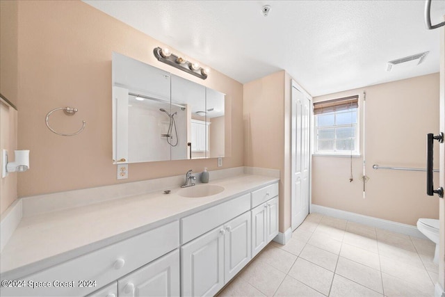 full bath with baseboards, visible vents, tile patterned floors, a textured ceiling, and vanity