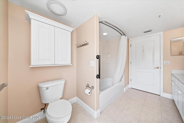 bathroom featuring visible vents, toilet, shower / bath combo, tile patterned flooring, and baseboards