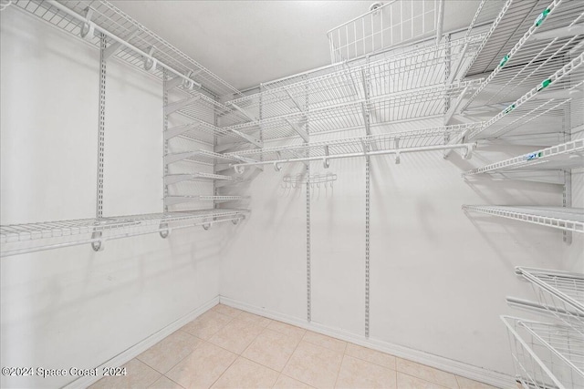 spacious closet with tile patterned flooring