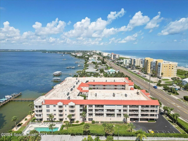 birds eye view of property with a water view