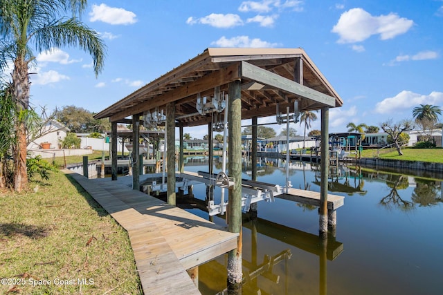 view of dock with a water view and boat lift