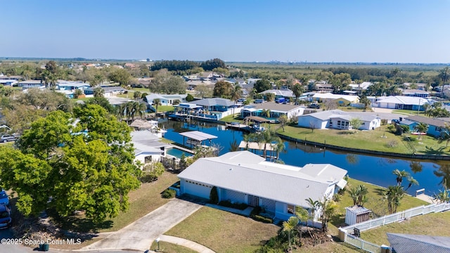 bird's eye view with a residential view and a water view