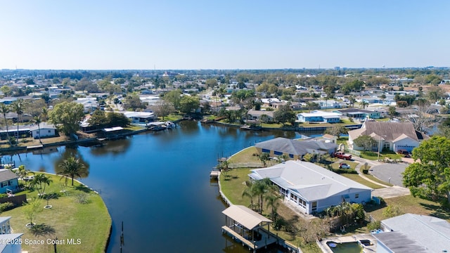 drone / aerial view featuring a water view and a residential view