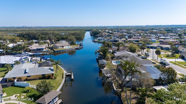 drone / aerial view with a water view and a residential view