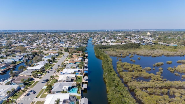 birds eye view of property featuring a water view and a residential view