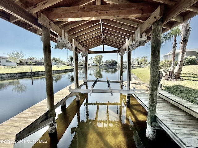 dock area featuring a water view and boat lift