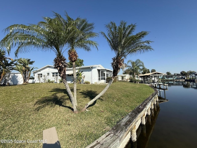 exterior space with a water view and a boat dock