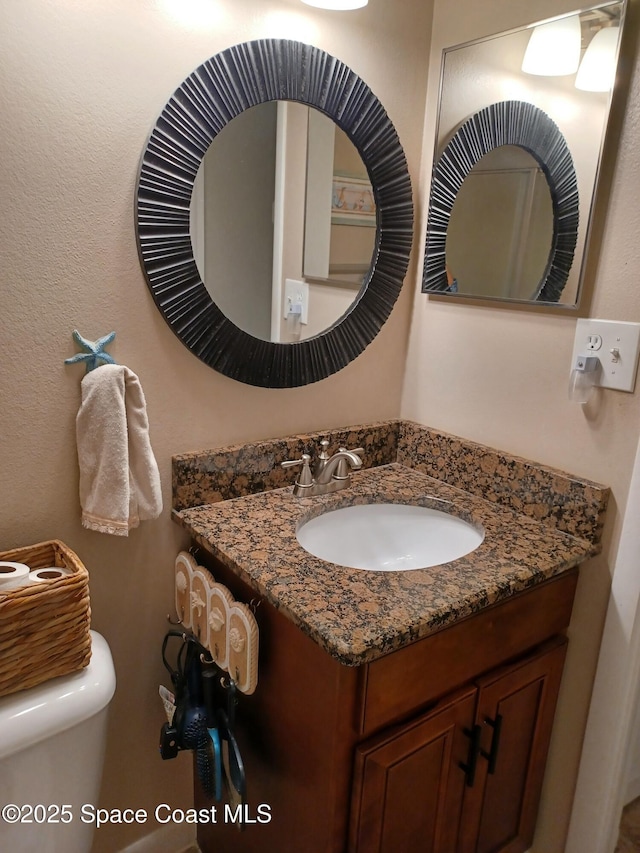 half bath with toilet and vanity