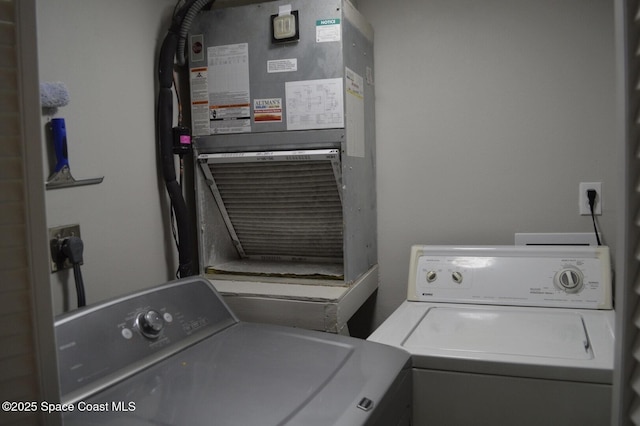 laundry area with laundry area and washer and clothes dryer