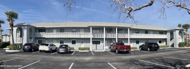 view of property with uncovered parking