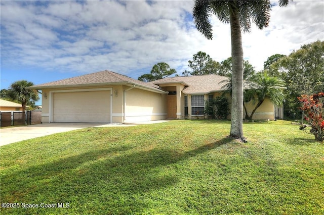 view of front of property with an attached garage, fence, concrete driveway, stucco siding, and a front lawn